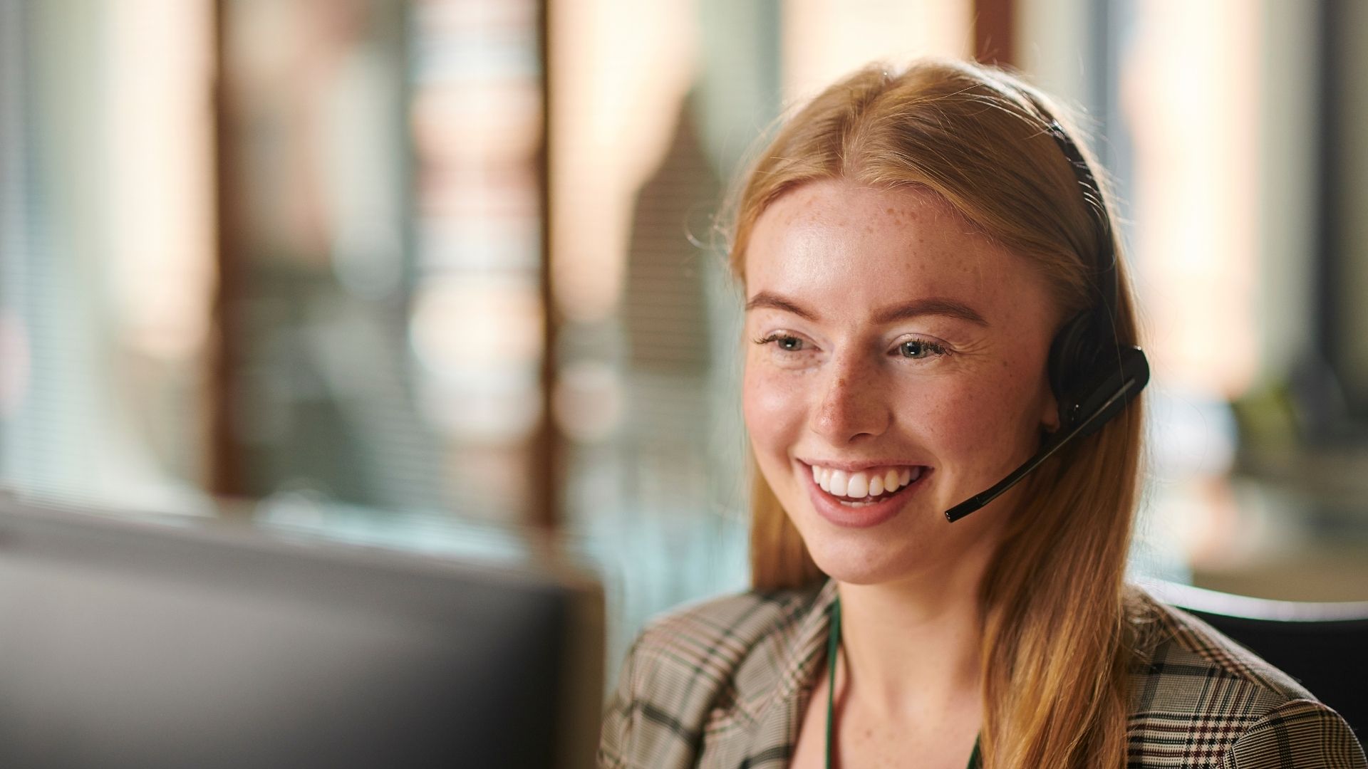 Customer service professional on call in office
